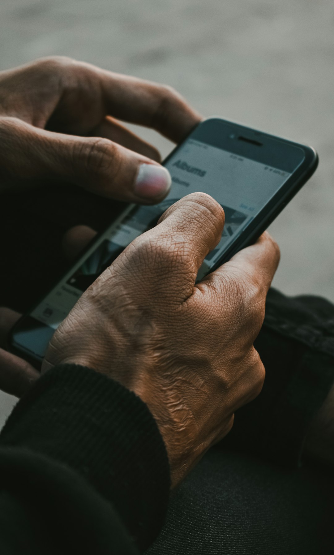why-choose-us A person goes through a lot in life and usually, we can see these experiences in the hands of the person. This photograph shows a man going down the lane of memories stored in his phone.